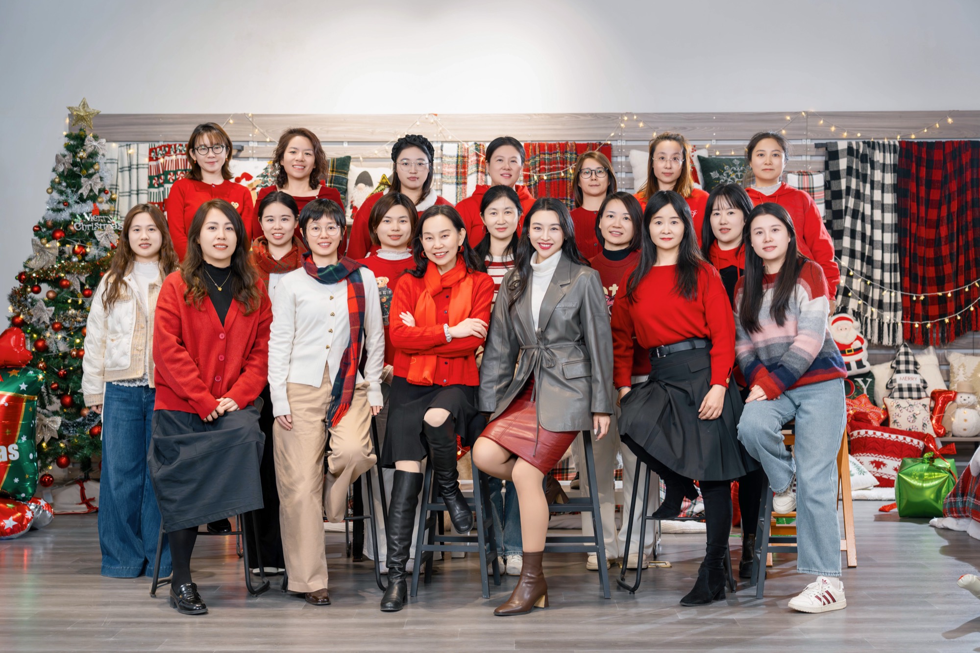 The women of ABS International gathered in the showroom among their own throws, pillows and blankets