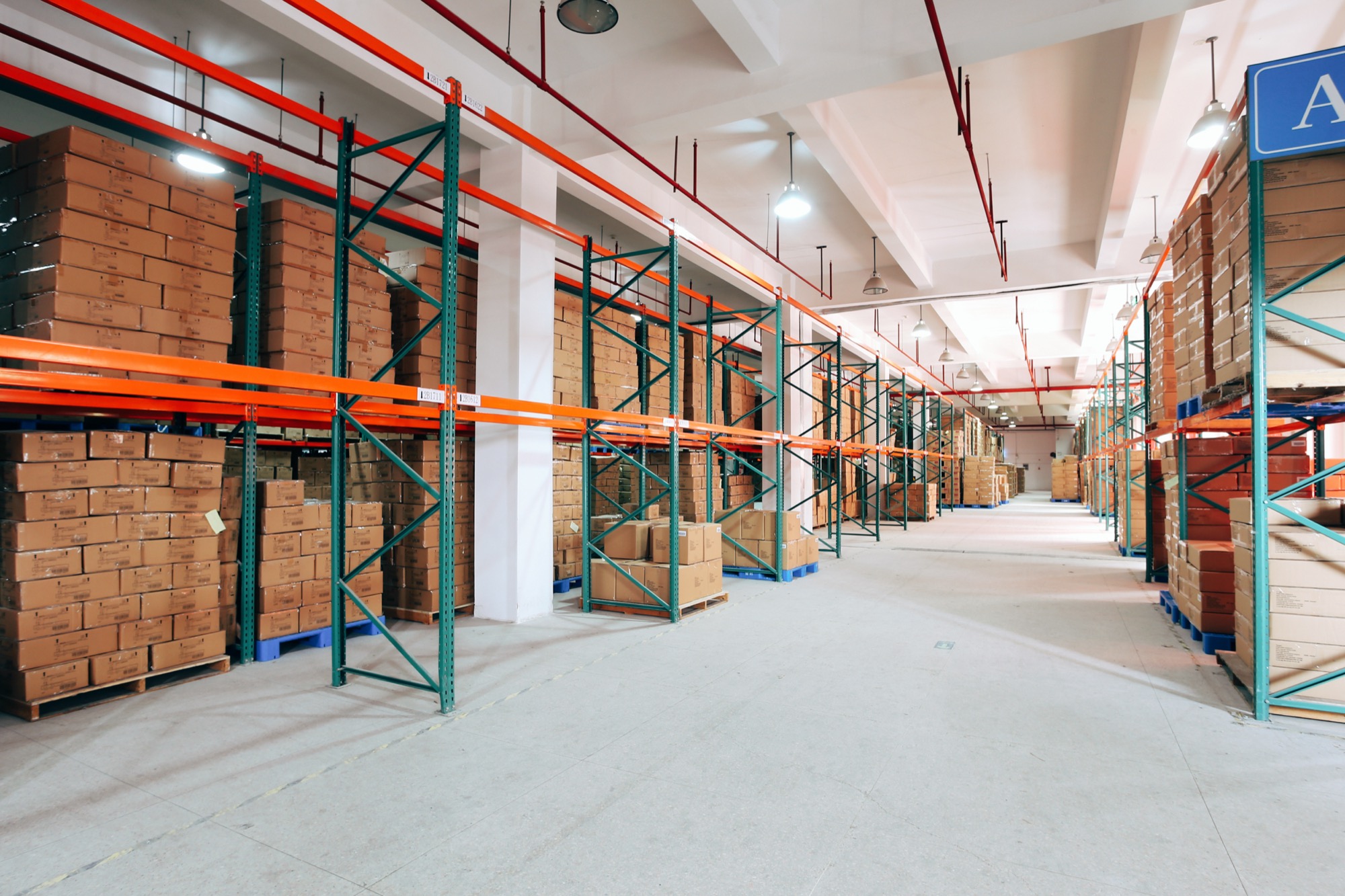 Warehouse racking stacked with boxed finished goods ready to ship