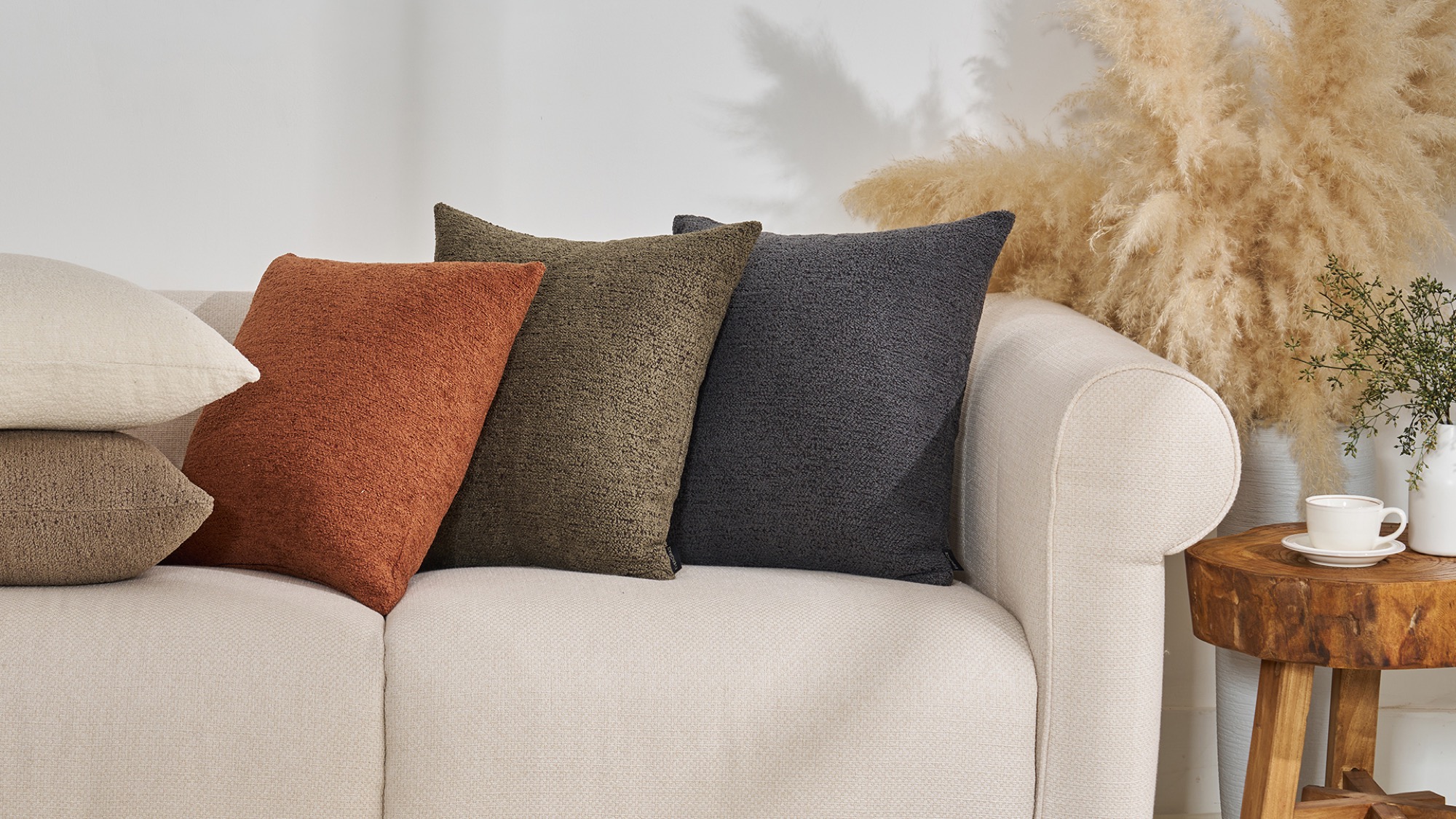 ABS home textiles — deco pillows styled on a sofa