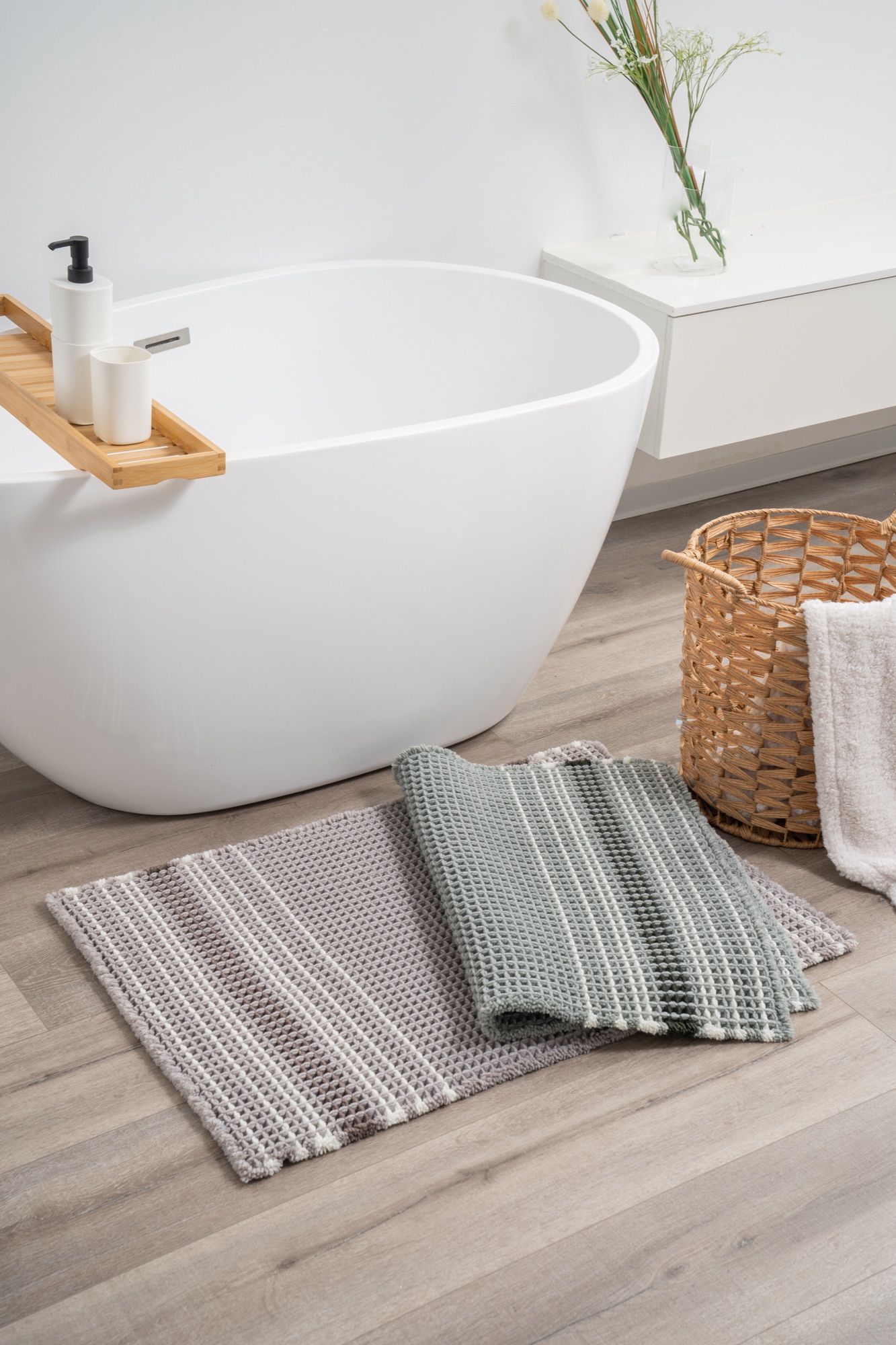 Sage and grey waffle-weave bath mats by ABS International